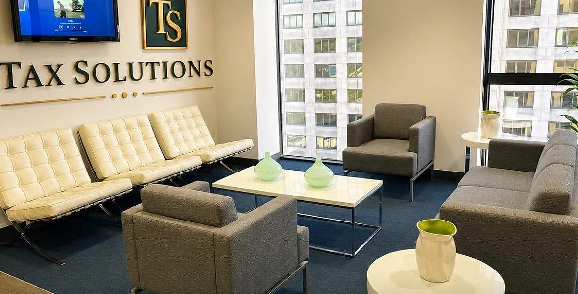 Tax Solutions waiting area at the Datran Center, with the Miami towers behind
